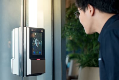 An employee having access control problems while using face recognition to enter a room.