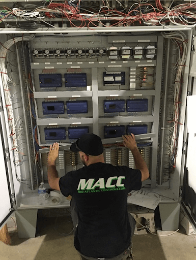 MACC technician repairing a building automation system