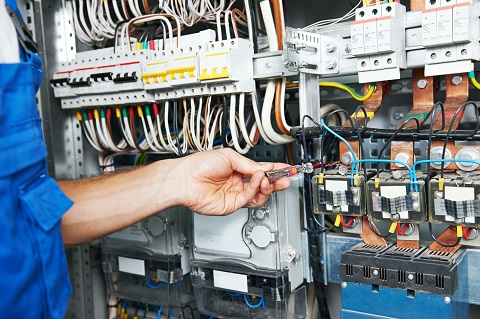 A technician diagnosing problems with a building automation system