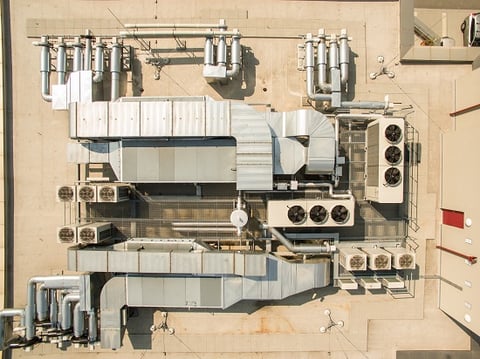 Air conditioning equipment atop a modern building - aerial/drone